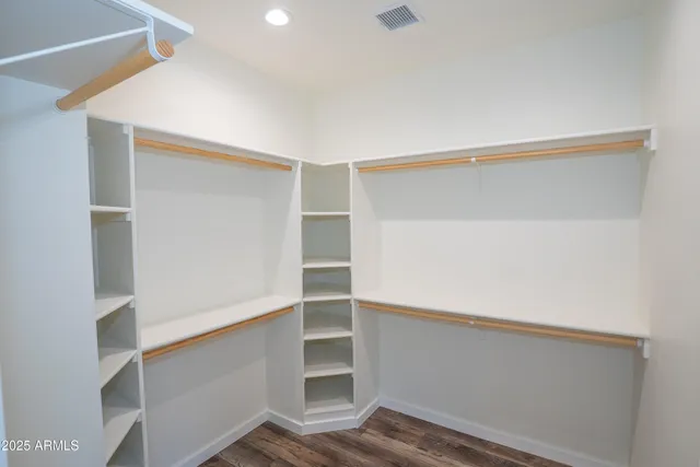 a view of an empty walk in closet