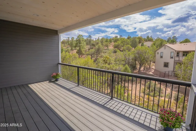 a view of a balcony with wooden floor