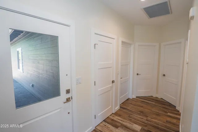a view of a bathroom from the hallway