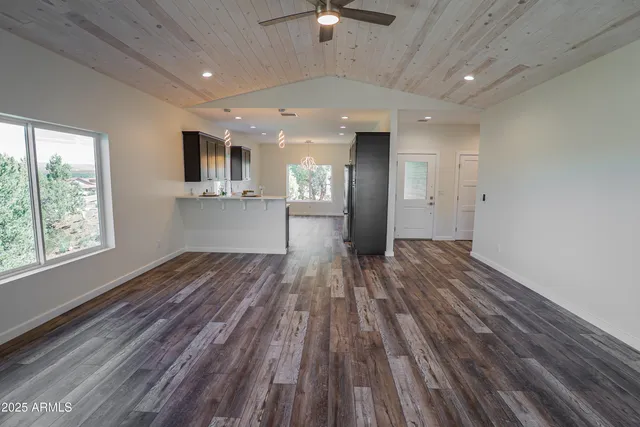 a view of kitchen and wooden floor