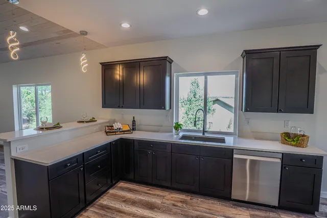 a kitchen with a sink and cabinets