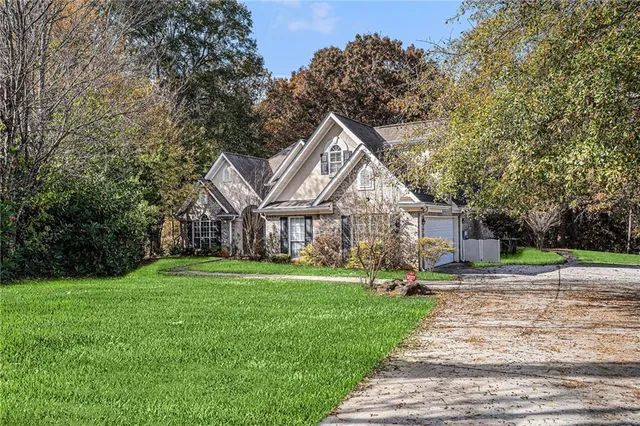 a front view of a house with a yard