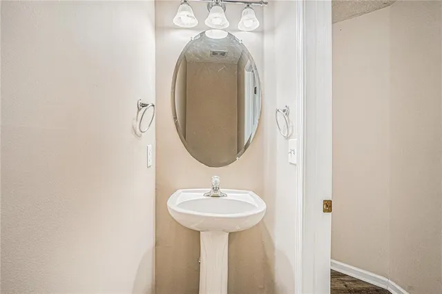 a view of an empty room with window and fireplace