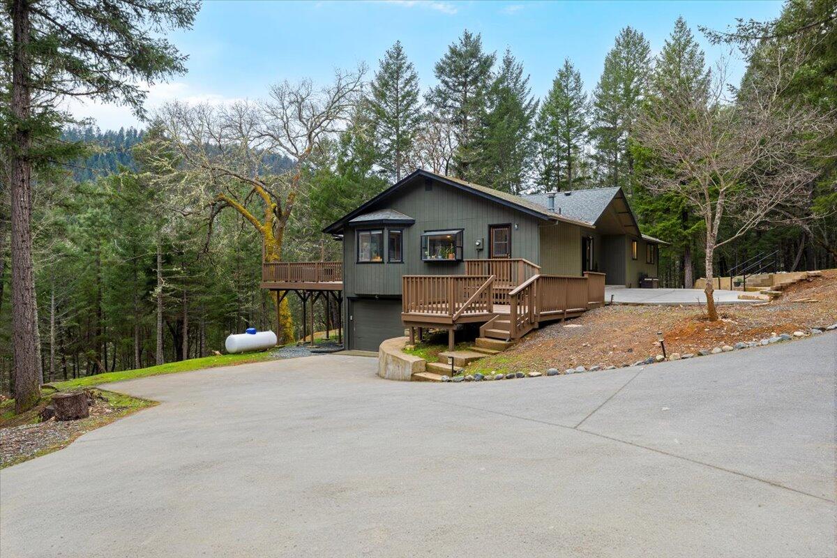 350 Splendor Drive Wilderville, OR 97543 - Photo 51 of 57 a view of a house with backyard and sitting area