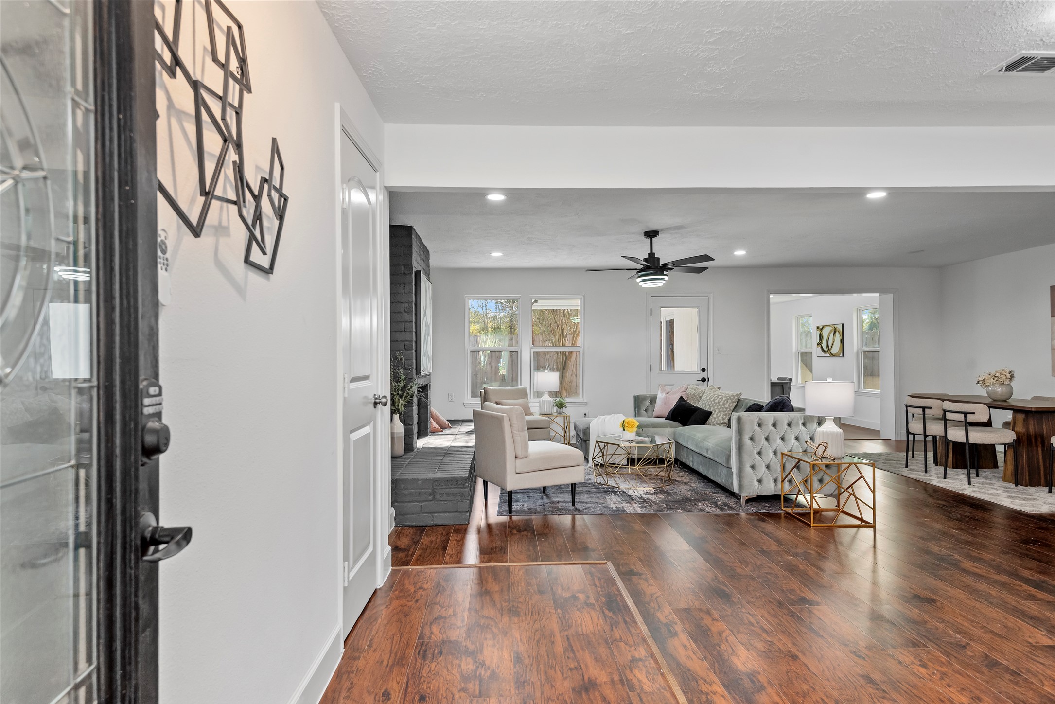 6126 Knotty Post Lane Spring, TX 77373 - Photo 1 of 18 a living room with furniture and wooden floor