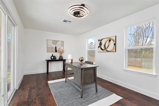 a view of workspace with wooden floor