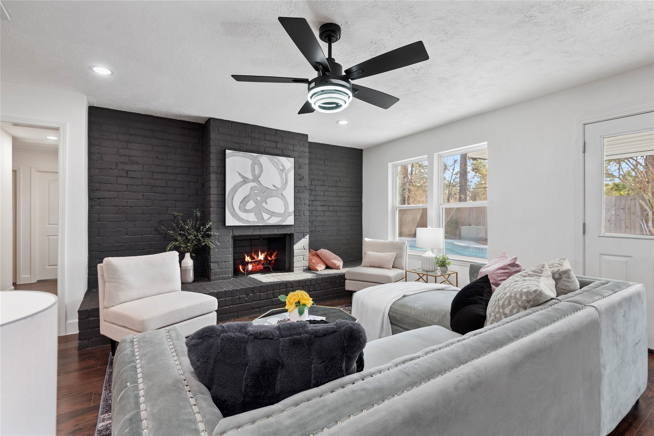 6126 Knotty Post Lane Spring, TX 77373 - Photo 16 of 18 a living room with furniture a fireplace and a window