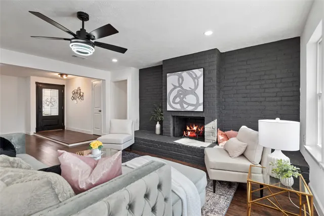 a living room with furniture and a fireplace