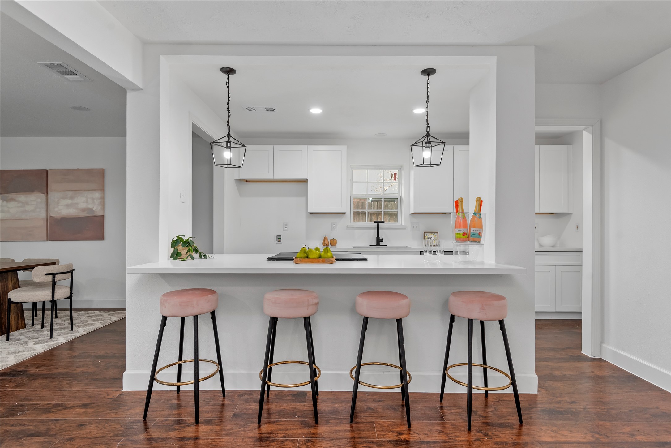 6126 Knotty Post Lane Spring, TX 77373 - Photo 2 of 18 a kitchen with stainless steel appliances a dining table chairs and wooden floor