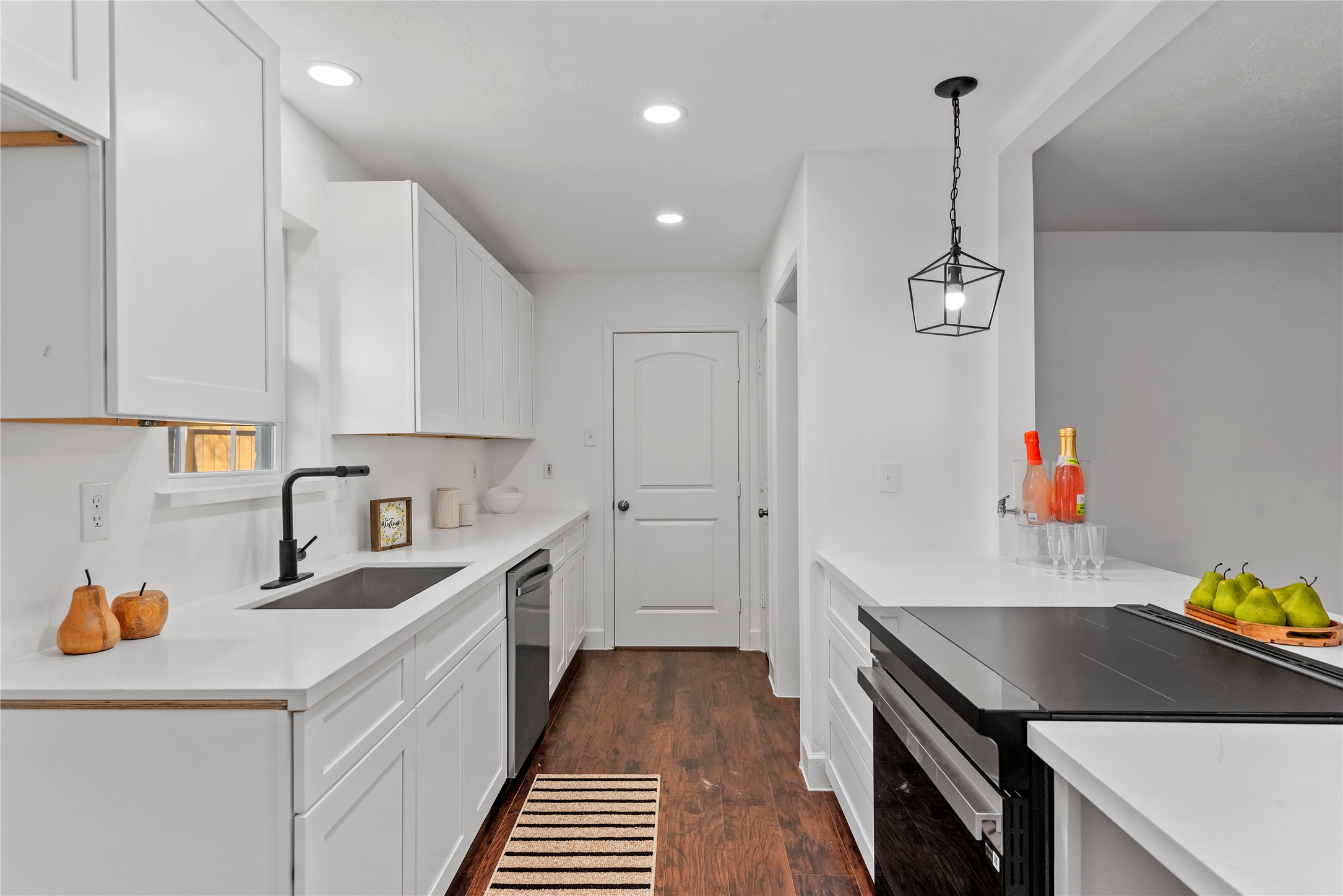 6126 Knotty Post Lane Spring, TX 77373 - Photo 6 of 18 a kitchen that has a lot of cabinets in it and wooden floors