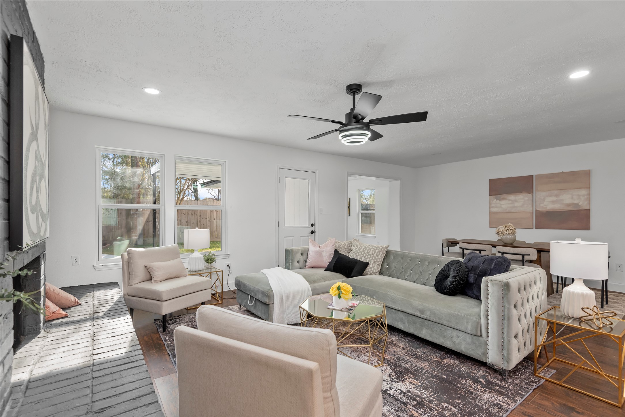 6126 Knotty Post Lane Spring, TX 77373 - Photo 9 of 18 a living room with furniture and a flat screen tv