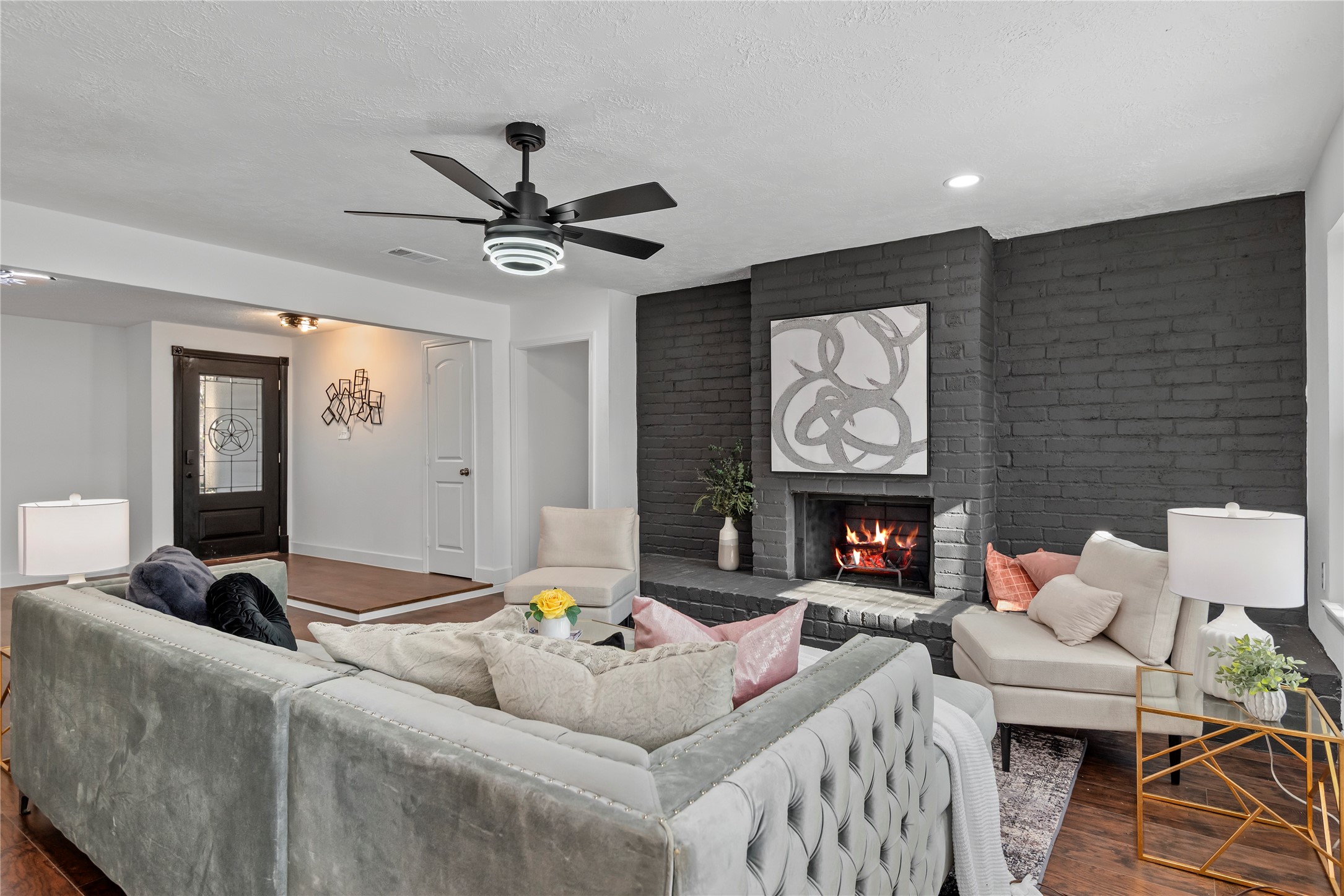 6126 Knotty Post Lane Spring, TX 77373 - Photo 10 of 18 a living room with furniture a fireplace and a flat screen tv