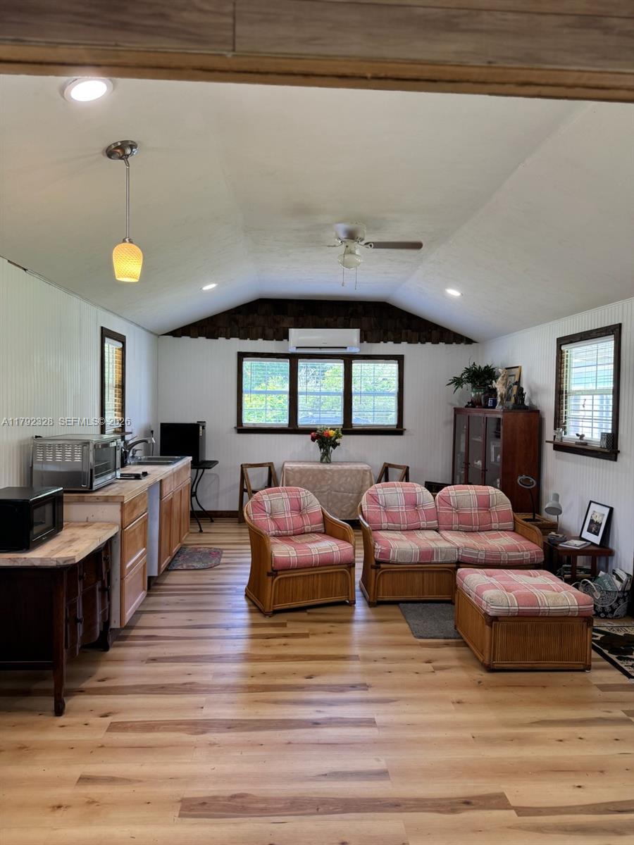 3725 Southwest 162nd Street Archer, FL 32618 - Photo 15 of 48 a living room with furniture and a wooden floor