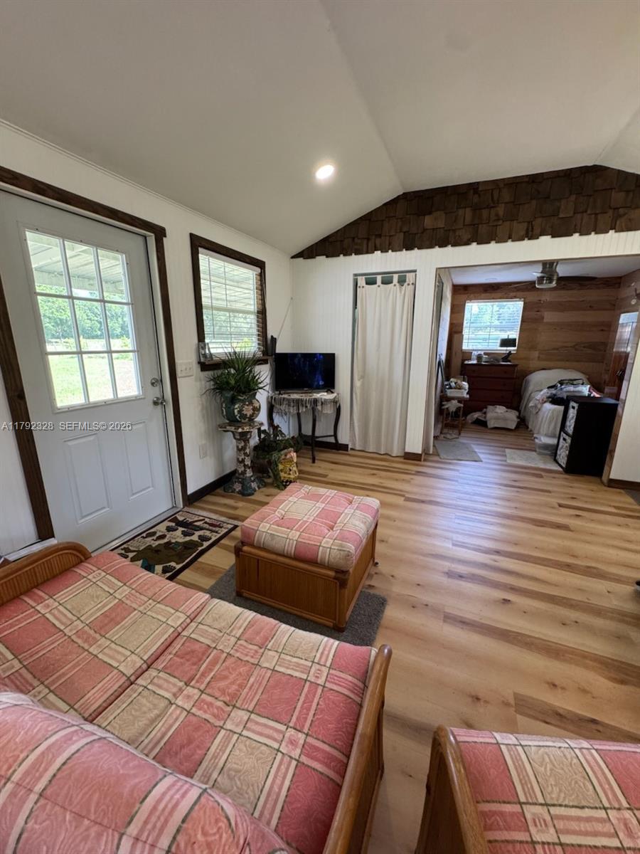 3725 Southwest 162nd Street Archer, FL 32618 - Photo 17 of 48 a bedroom with furniture and a window