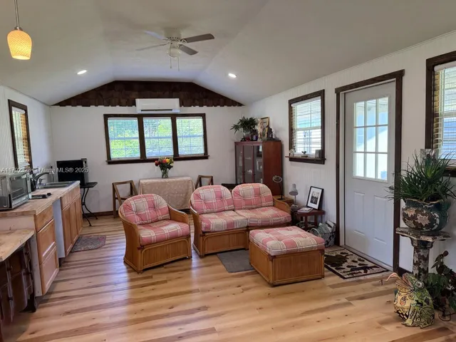 a dining room with furniture and book shelf