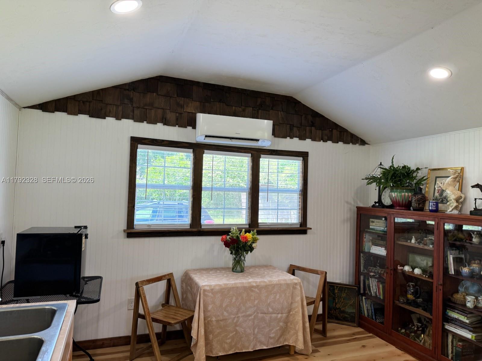 3725 Southwest 162nd Street Archer, FL 32618 - Photo 22 of 48 a living room with furniture and a flat screen tv