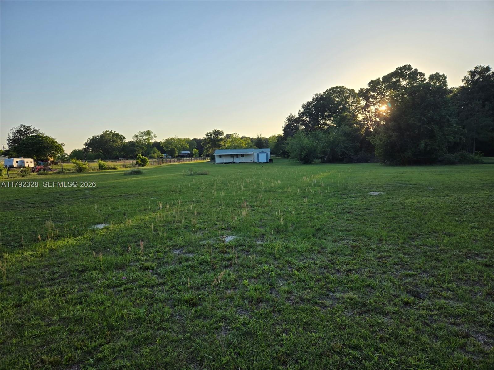 3725 Southwest 162nd Street Archer, FL 32618 - Photo 31 of 48 a backyard of a house with lots of green space