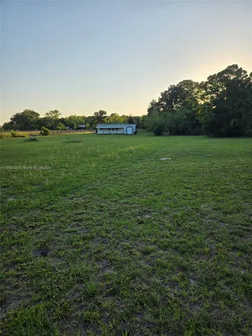 a backyard of a house with lots of green space