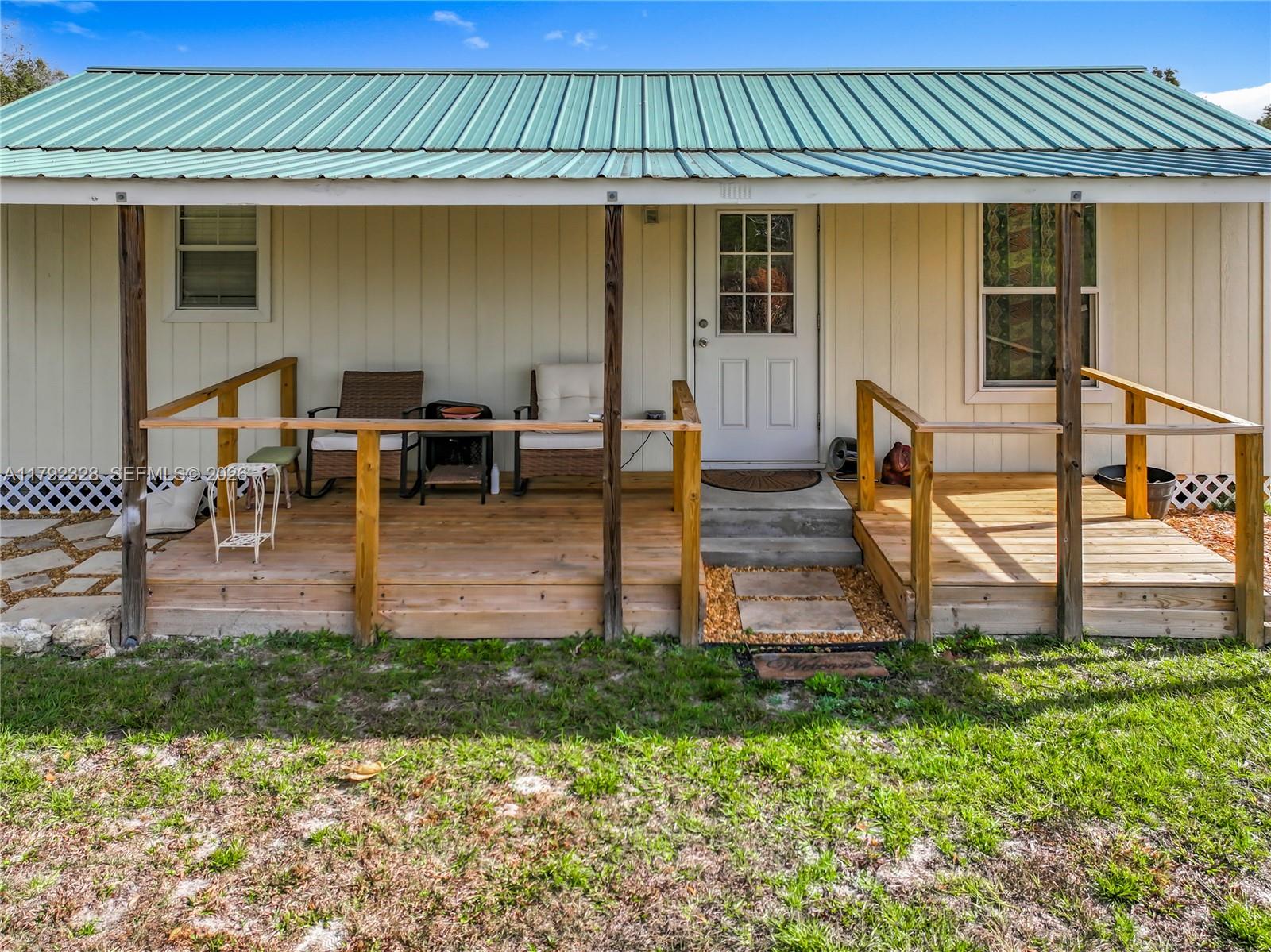 3725 Southwest 162nd Street Archer, FL 32618 - Photo 37 of 48 a view of a house with backyard and sitting area
