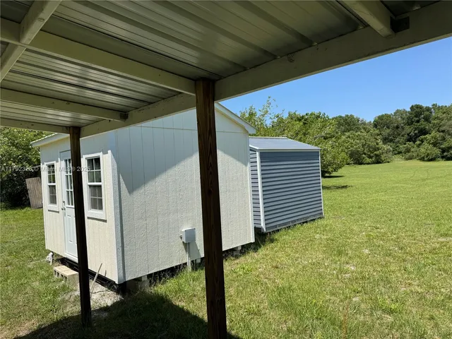 a house view with a backyard space