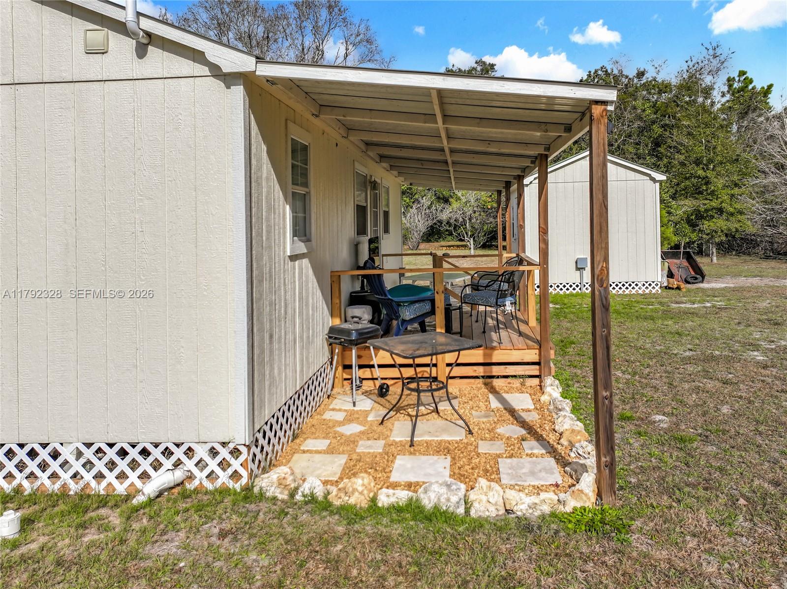 3725 Southwest 162nd Street Archer, FL 32618 - Photo 41 of 48 a view of a porch with furniture