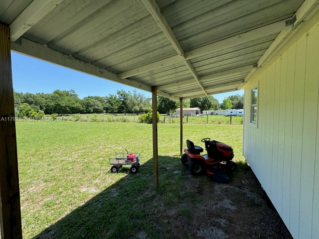 3725 Southwest 162nd Street Archer, FL 32618 - Photo 7 of 48 a view of a couches in patio of a yard