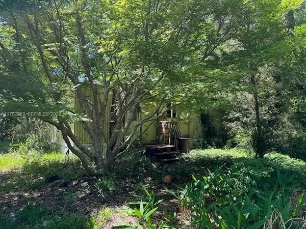 a view of outdoor space with deck and yard