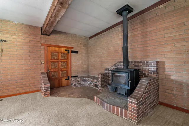a view of a door and chair in the room