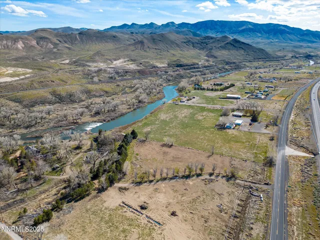 a view of a backyard with wooden floor and a mountain view