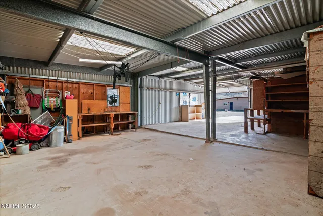a view of an empty room with wooden roof