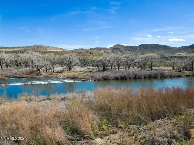 a view of a lake with mountains in the background