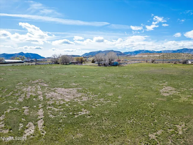 a view of a lake with houses in the back