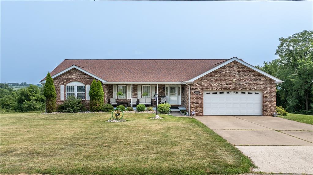 4487 Battle Ridge Road Oakdale, PA 15071 - Photo 1 of 46 a front view of a house with a yard and garage