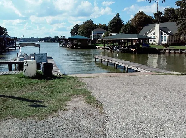 a view of a lake with boats and trees