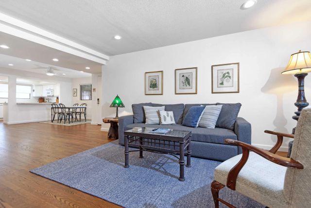 a living room with furniture and a rug