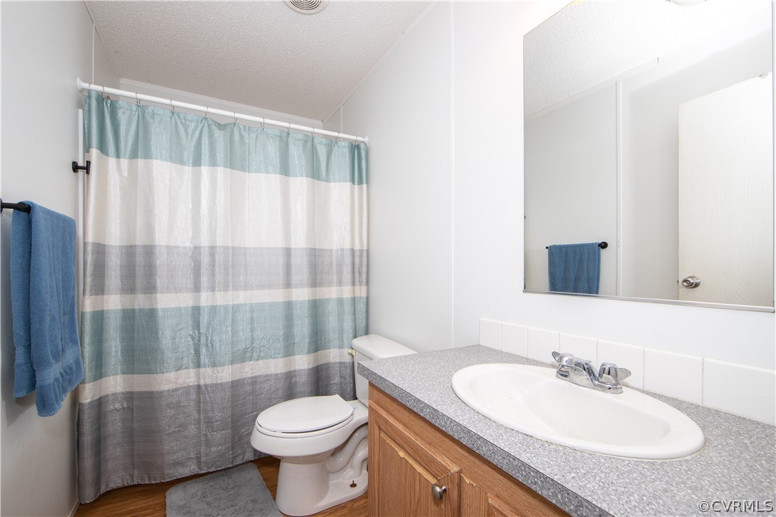 38 Bonbrook Creek Road Cumberland, VA 23040 - Photo 17 of 25 The hall bath is a full bath with shower tub combo and LVP flooring.