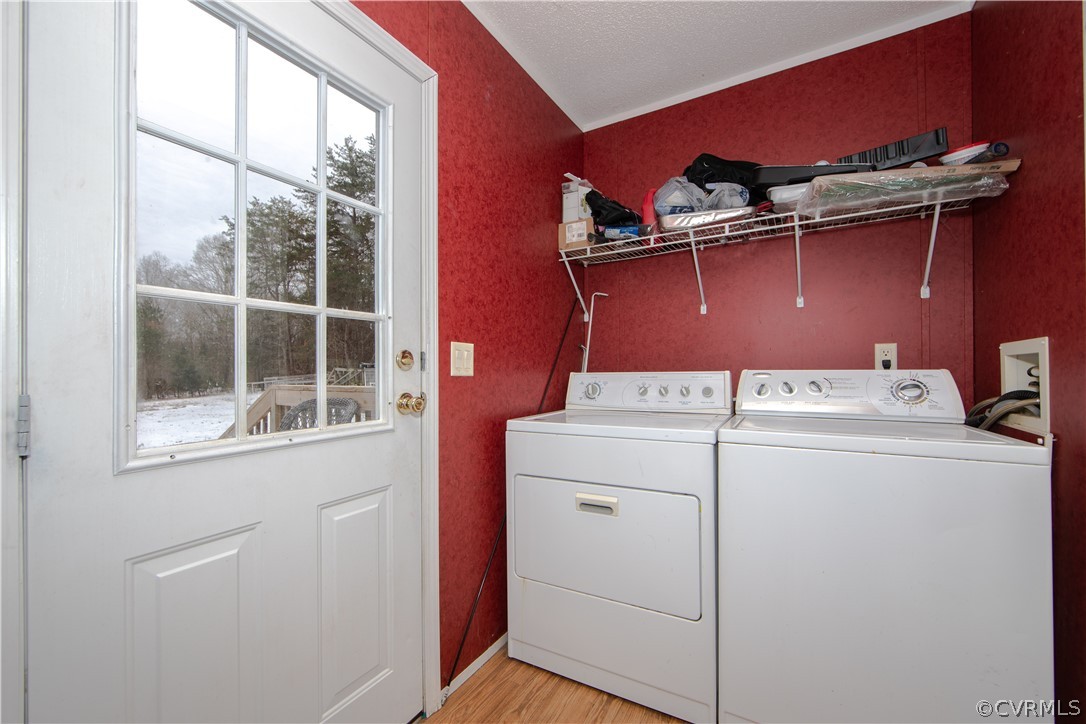 38 Bonbrook Creek Road Cumberland, VA 23040 - Photo 21 of 25 The laundry boasts built-in shelving for storage and access to the back deck.