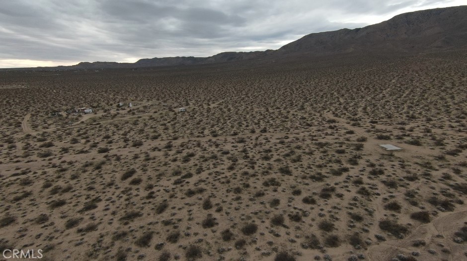 1234 1 Hole Spring Road Landers, CA 92285 - Photo 3 of 9 a view of a large mountain with mountains in the background