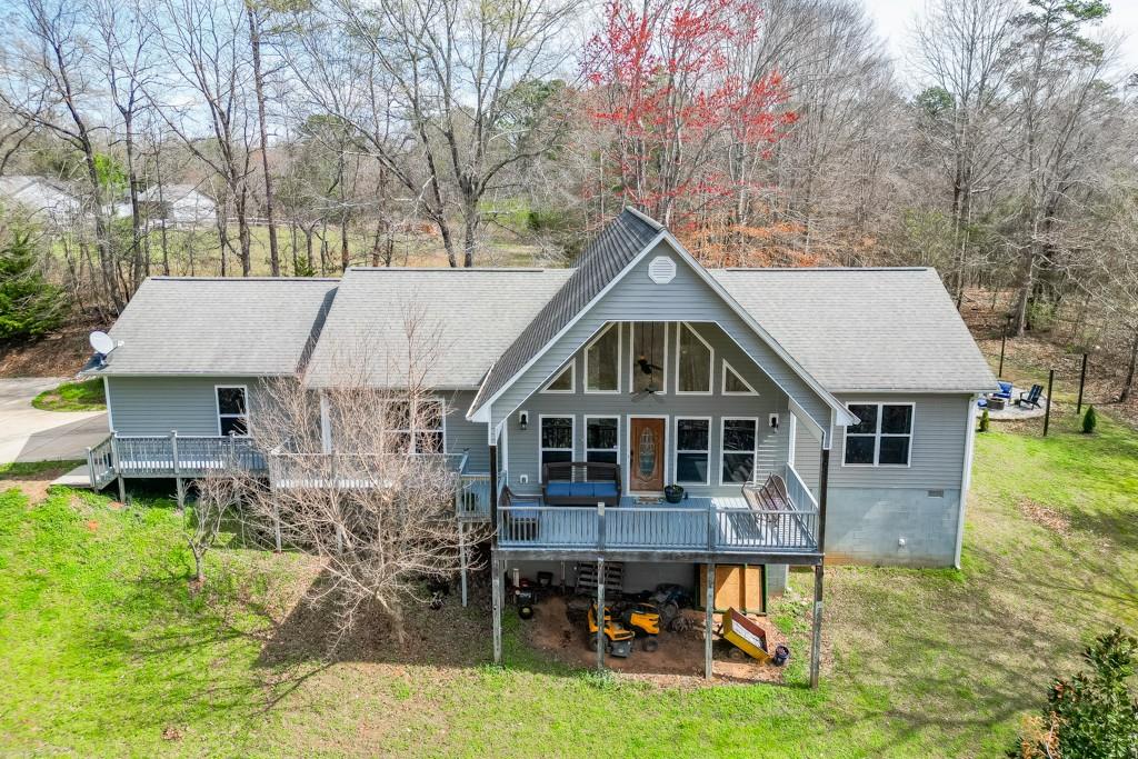 a front view of a house with a yard table and chairs