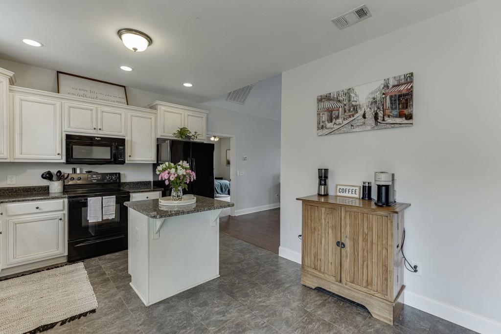 5050 Cagle Mill Road Lula, GA 30554 - Photo 15 of 48 a kitchen with cabinets and appliances
