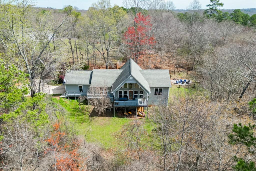 5050 Cagle Mill Road Lula, GA 30554 - Photo 2 of 48 a aerial view of a house with a big yard and large trees