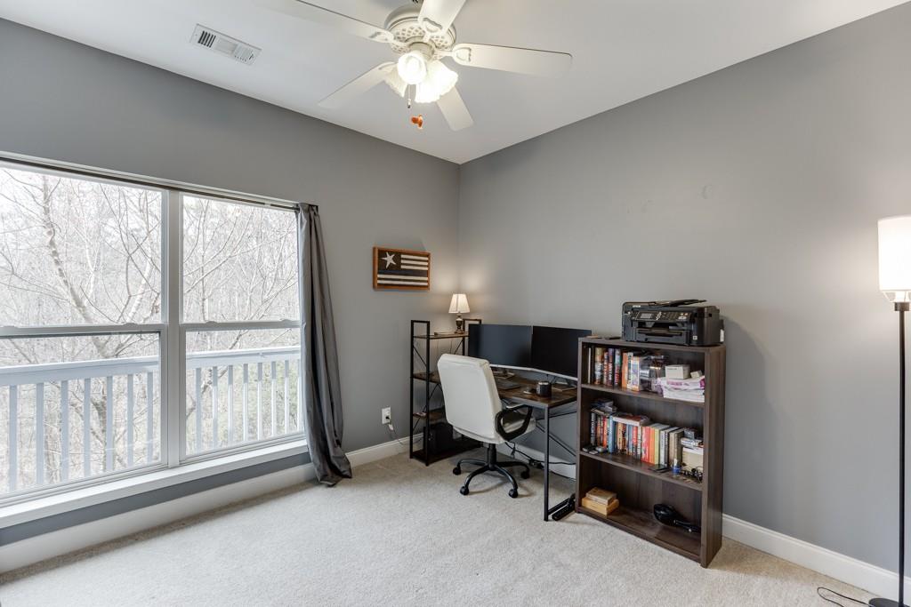5050 Cagle Mill Road Lula, GA 30554 - Photo 23 of 48 a view of a workspace with furniture and a window