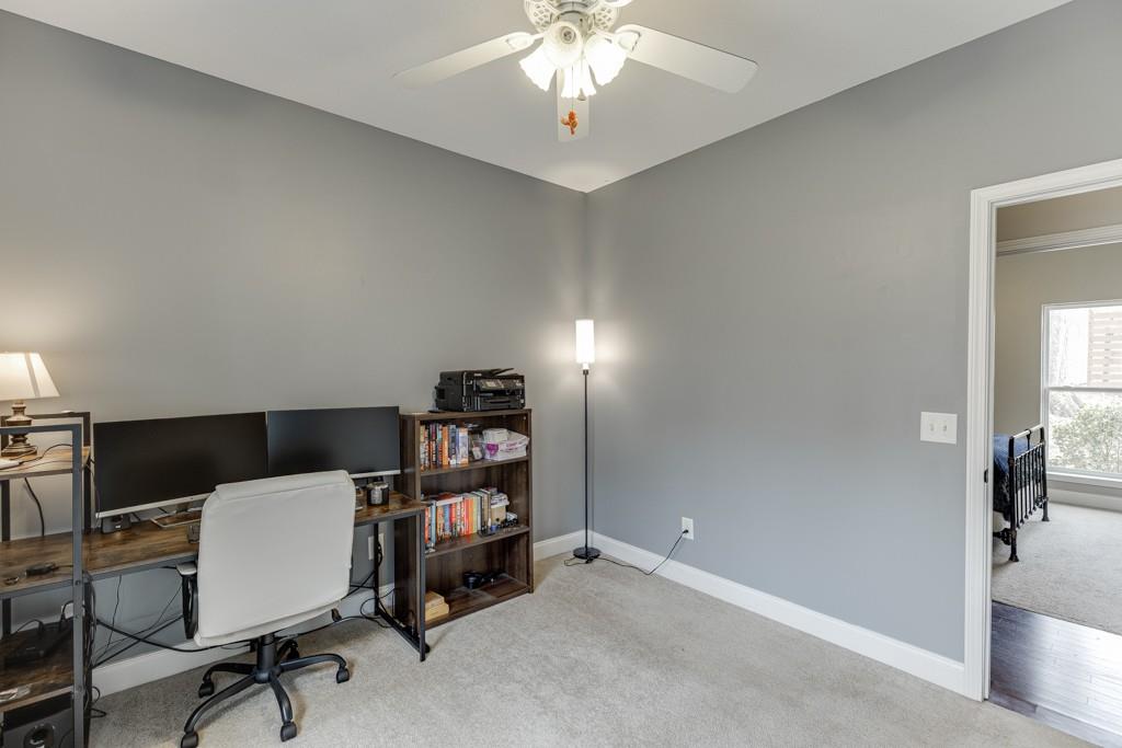 5050 Cagle Mill Road Lula, GA 30554 - Photo 24 of 48 a workspace with a bookshelf