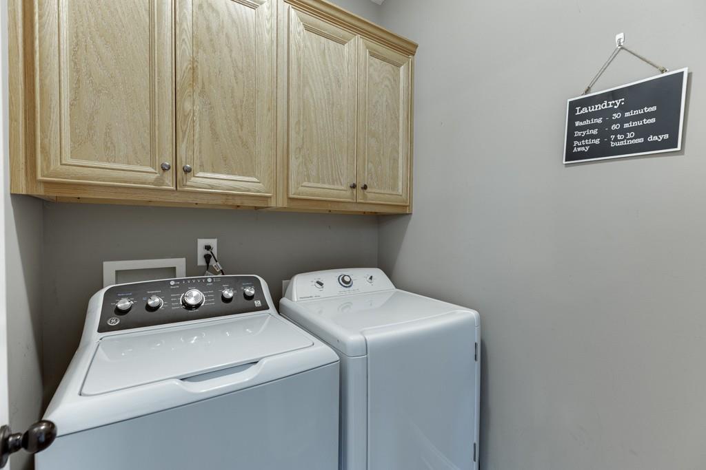 5050 Cagle Mill Road Lula, GA 30554 - Photo 27 of 48 a view of washer and dryer with kitchen appliances