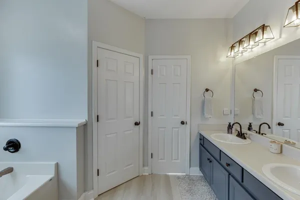 a bathroom with a bathtub and a sink