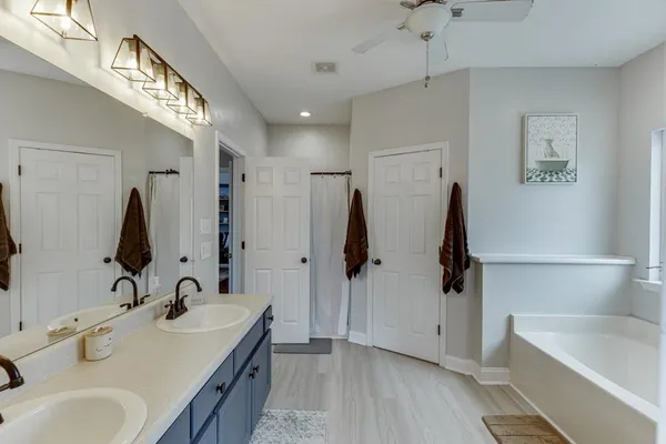 a view of a chairs and table on the wooden floor