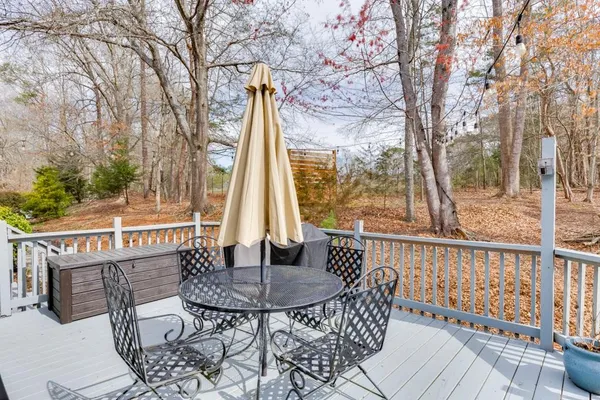 a view of balcony with wooden floor