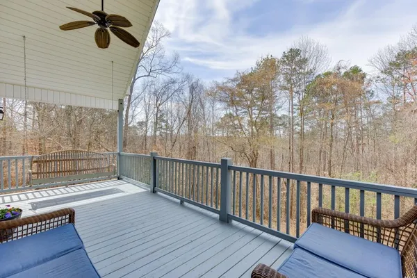a view of house with backyard and trees