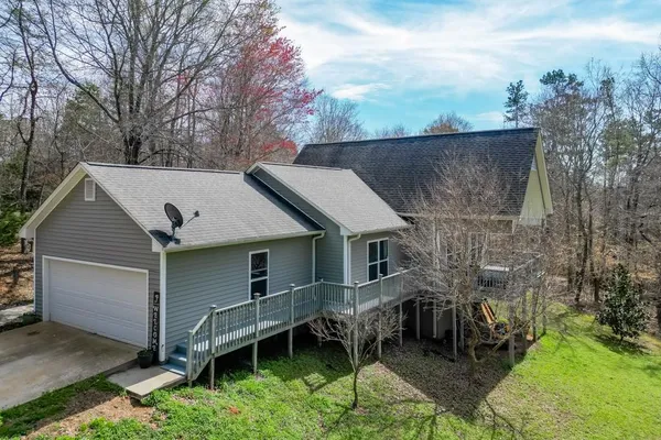 a house that has a tree in front of it