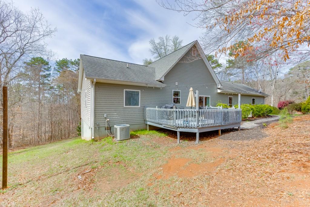 5050 Cagle Mill Road Lula, GA 30554 - Photo 41 of 48 a view of a house with backyard and sitting area